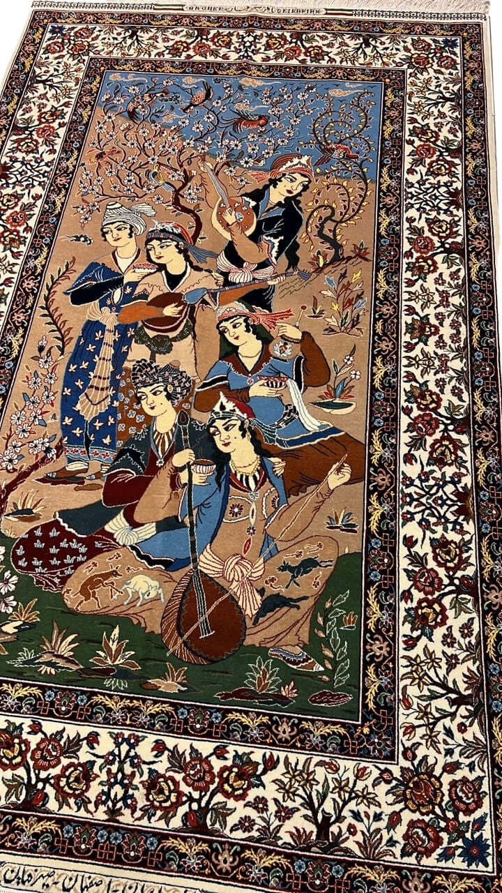 "Close-up of Master Bagher Seirafian’s hand-knotted pictorial rug, showcasing intricate details of Persian musicians and floral motifs in natural dyes."